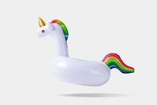 Inflatable Unicorn Pool Toy On White Background. Minimal Summer Concept.