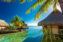 Over Water Bungalows And Green Lagoon, Moorea, French Polynesia