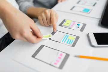 app design, technology and business concept - web designers or developers working on user interface 