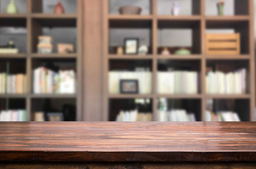 Wooden board empty table space platform in front of blurred library Of The background - can be used for display or montage your products. Mock up for display of product.