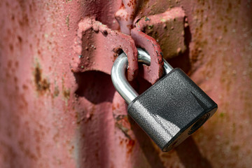 Closeup metal door with lock in grungy style and good texture