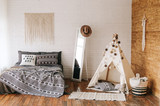 Fototapeta Boho - interior bedroom with bed boho style decor