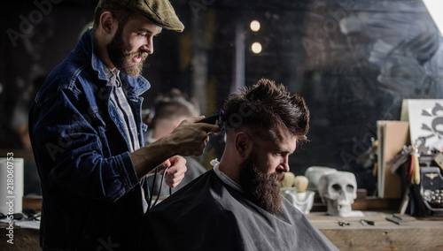 Barber With Clipper Trimming Hair On Nape Of Client Barber With