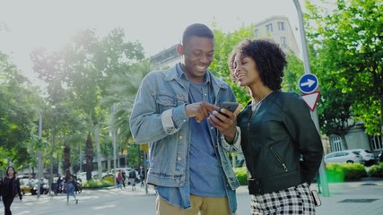 Wall Mural - Young happy black couple outdoors