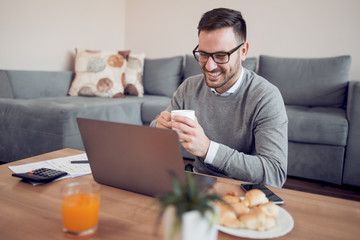 Wall Mural - Businessman working from home on laptop