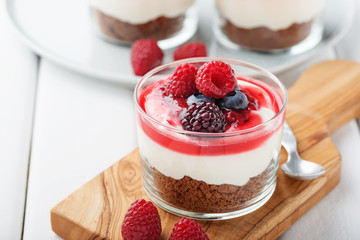 Cheesecake in glass  with fresh raspberries and cream cheese. Healthy homemade organic dessert.