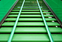 Modern Green Steel Staircase In A Bicycle Parking With Bicycle Gutter