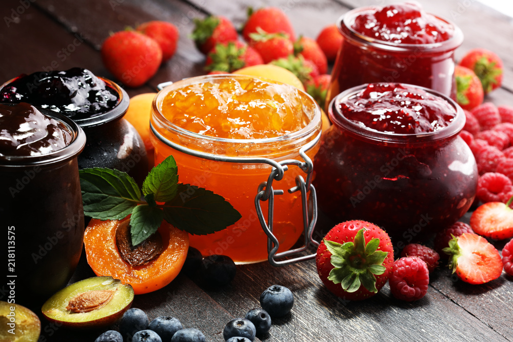 assortment of jams, seasonal berries, apricot, mint and fruits. marmalade or confiture - obrazy, fototapety, plakaty 