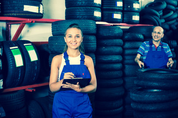 Sticker - Portrait of mechanic girl in coveralls having cardboard with documents in hands