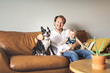 © Louis-Paul Photo - Young father with baby daughter on sofa at home