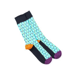 Colorful socks on white background, top view