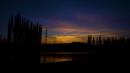 Wall Mural - High power pylons with sunset timelapse