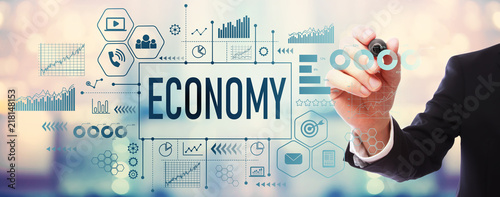 Fotografía Economy with businessman on blurred abstract background