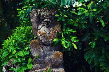 Beautiful view of ancient stone carving of temple on Bali island. Gunung Kawi Temple and Candi in jungle at Bali, Indonesia. Old temples in the jungle. Ancient temple ruins. Carved in stone temple.