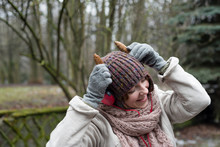 Funny Woman In Hat And Headphones Listening To Music In The Outdoors