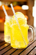 Close-up of mason jar glasses of homemade lemonade with slices of lemon