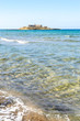 Beautiful crystal clear water at Isola delle Correnti (Currents Island), near Portopalo di Capo Passero, Syracuse, Sicily, Italy, Dreamy and idyllic spring holiday destination near Noto and Marzamemi.