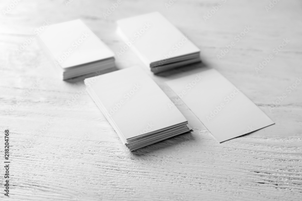 Blank business cards on wooden background