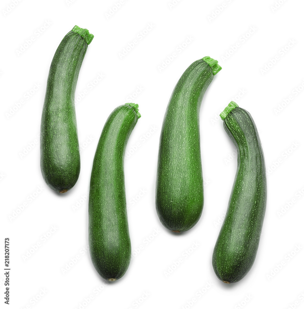 Ripe zucchinis on white background