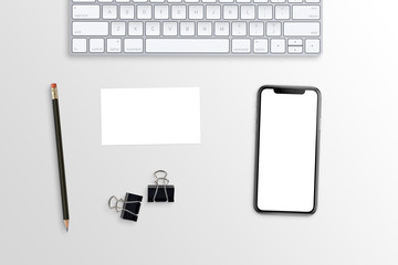 Poster - Phone and business card mockup on white office desk. Keyboard, poster clips and pencil beside.