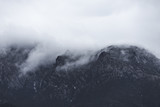 Fototapeta Na ścianę - Dark Mountains on Cloudy Day