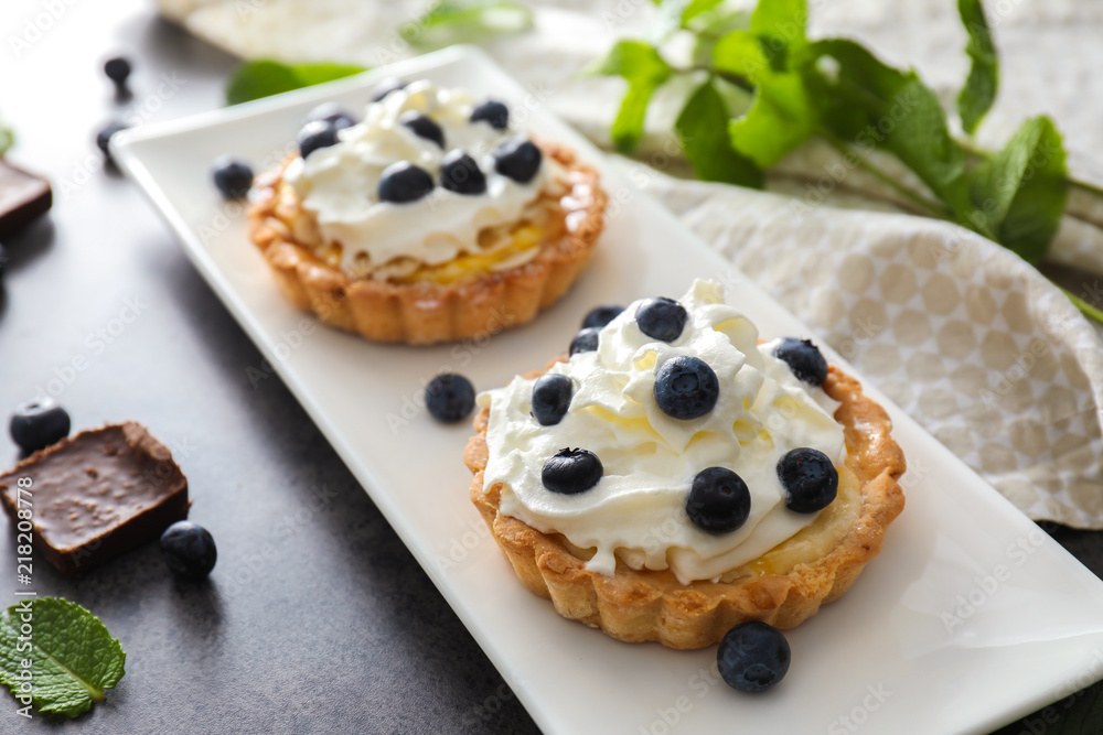 Delicious blueberry tarts on plate