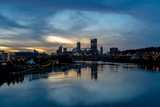Fototapeta  - The city of Pittsburgh at sunset with clouds taken above the Ohio River