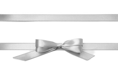 silver ribbons with bow on white background