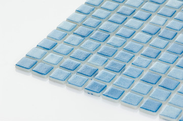 little blue ceramic tile on a white background, majolica. for the catalog