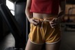 © Wavebreak Media - Woman tying knot of boxer in fitness studio