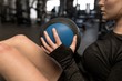 © Wavebreak Media - Woman doing oblique exercise in fitness studio