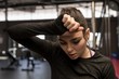 © Wavebreak Media - Woman wipes sweat after workout in fitness studio