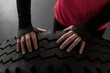 © Wavebreak Media - Woman exercising with tire in fitness studio
