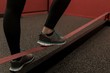 © Wavebreak Media - Woman doing exercise with rubber band in fitness gym