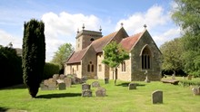 Old Church And Graves In English Village Churchyard