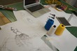 © Wavebreak Media - Sketch, thread, laptop kept on table