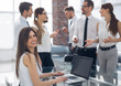 © ASDF - business team at workplace in office