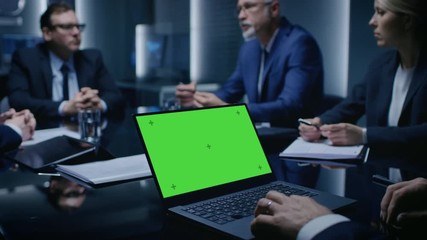 Poster - On the Table Laptop Showing Green Mock-up Screen: Team of Politicians, Corporate Business Leaders and Lawyers Sitting at the Negotiations Table in the Conference Room, Trying to Come to an Agreement. 