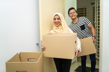 Wall Mural - asian couple moving house together with box