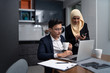 © Kencana Studio - asian malay couple working together at home with laptop and calculator