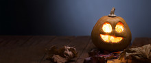 Jack O Lanterns Halloween Pumpkin Face On Wooden Background