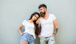 © be free - Couple white shirts cuddle each other. Hipster bearded and stylish girl hang out urban romantic date. Couple stylish youth. Romantic couple. Couple in love hang out together grey wall background