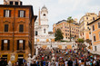 Crowd of tourists on Spanish Steps in Rome, Italy.The monumental stairway of 135 steps between the Piazza di Spagna and Piazza Trinita dei Monti.
