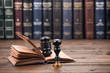 Notary Seal, Judge Gavel and Law book on a wooden background.
