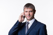 © Yarkovoy - Happy Businessman Talking On Telephone Over White Background