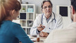 © sebra - Doctor talking a young couple of patients