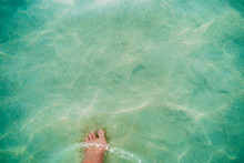 Walk Through The Shallow Water At The Beach