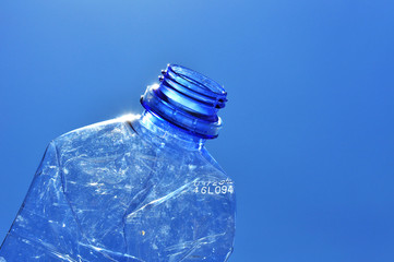 old plastic bottle against blue sky