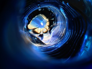 Beautiful unusual blue abstract background. The flower under the water