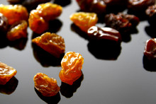 Raisins Background / A Raisin Is A Dried Grape. Raisins Are Produced In Many Regions Of The World And May Be Eaten Raw Or Used In Cooking, Baking, And Brewing.